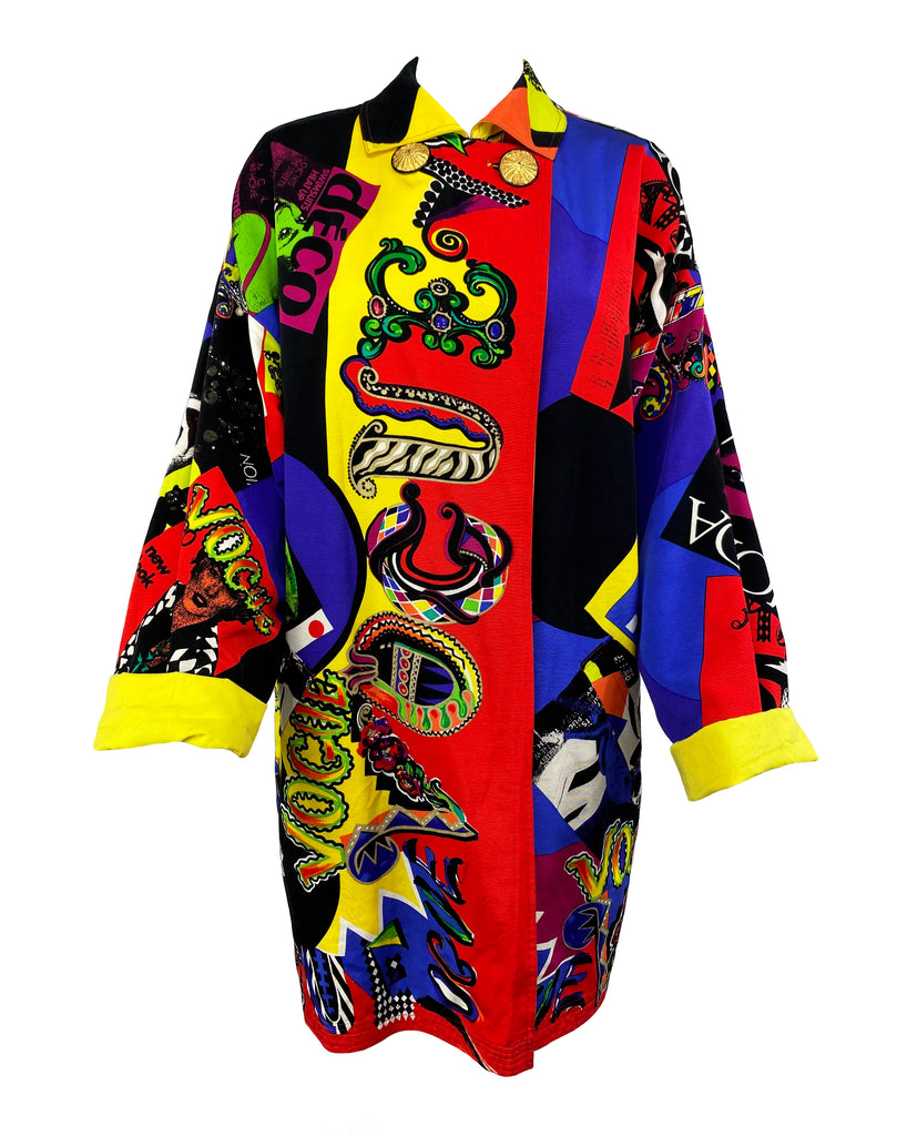 FRUIT Vintage Gianni Versace Vogue print coat from the iconic Spring 1991 runway collection. It features the iconic Vogue print in large scale all over and is fully reversible with a yellow cotton lining. This coat is a true piece of fashion history!