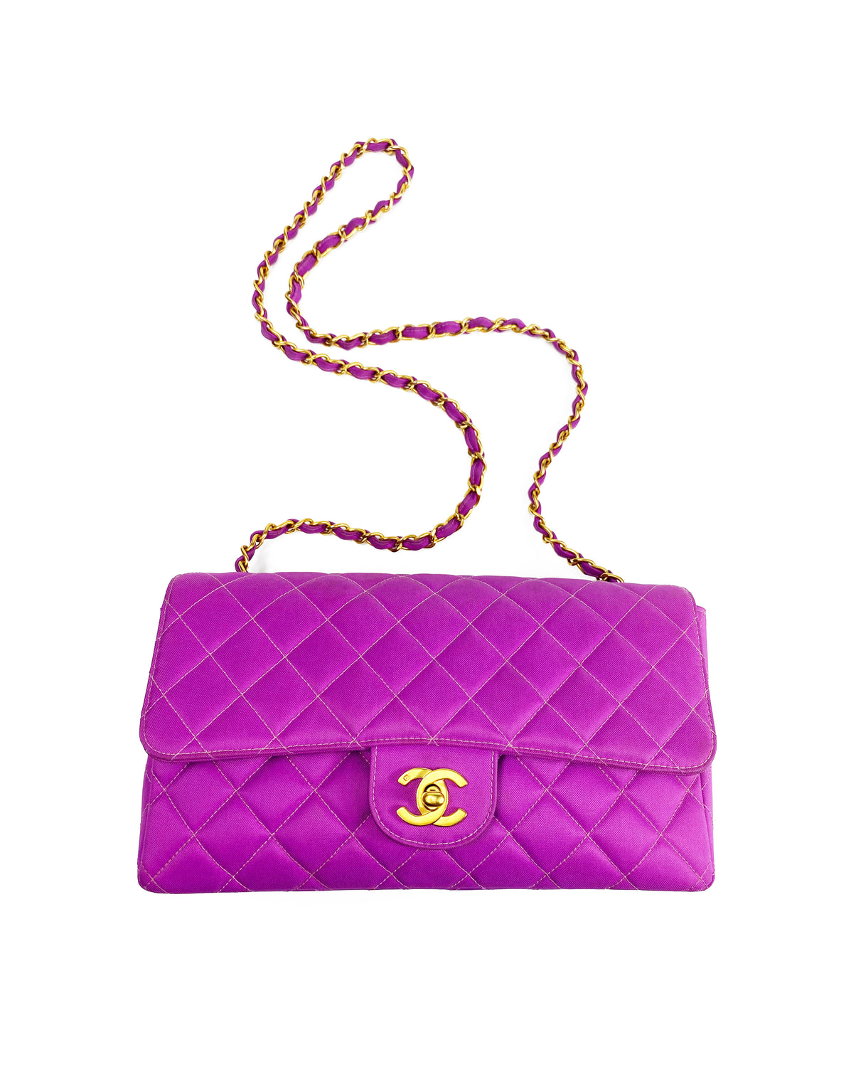 Fruit Vintage classic Chanel quilted nylon flap bag in extremely rare purple nylon, dating to 1995. Features the classic Chanel flap structure with contrast pale purple stitching and matte gold hardware.