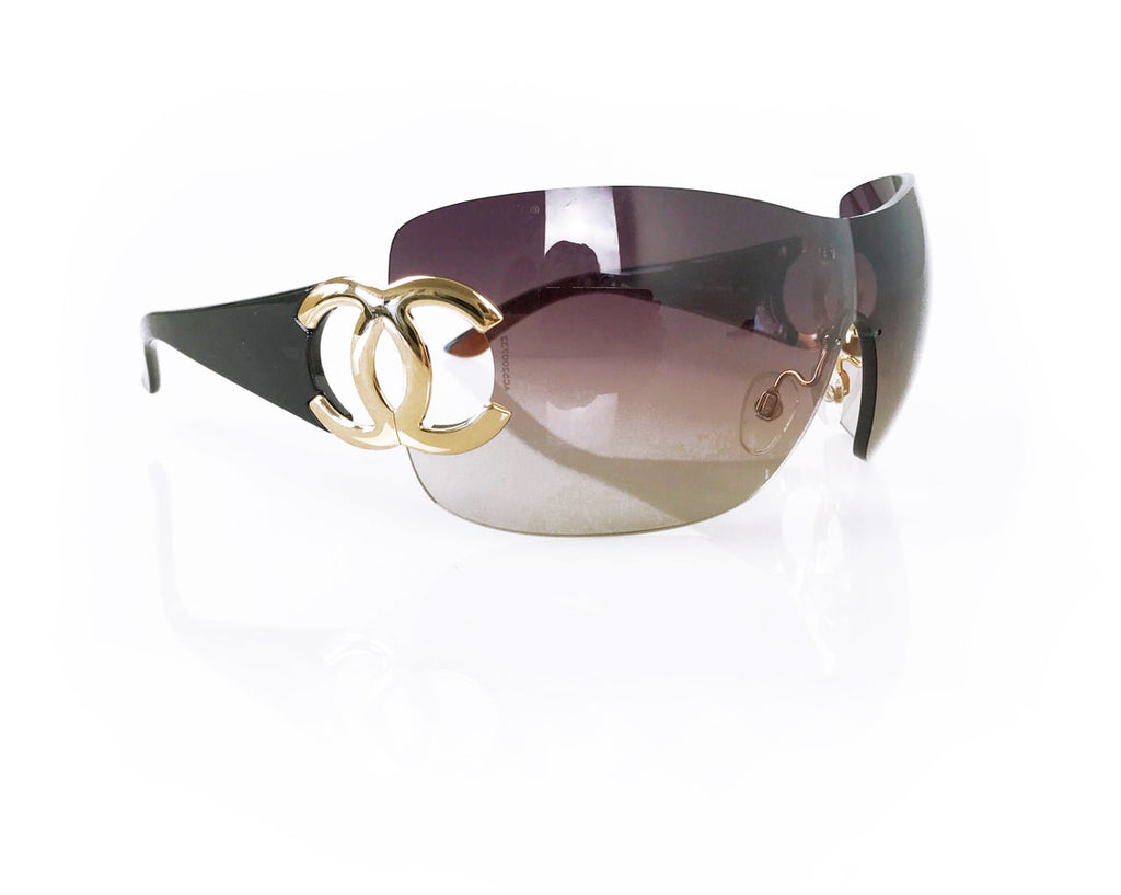 Fruit Vintage Chanel large Y2K logo sunglasses. They feature big Chanel CC logo monograms to each side and a classic early 2000s shield shape.