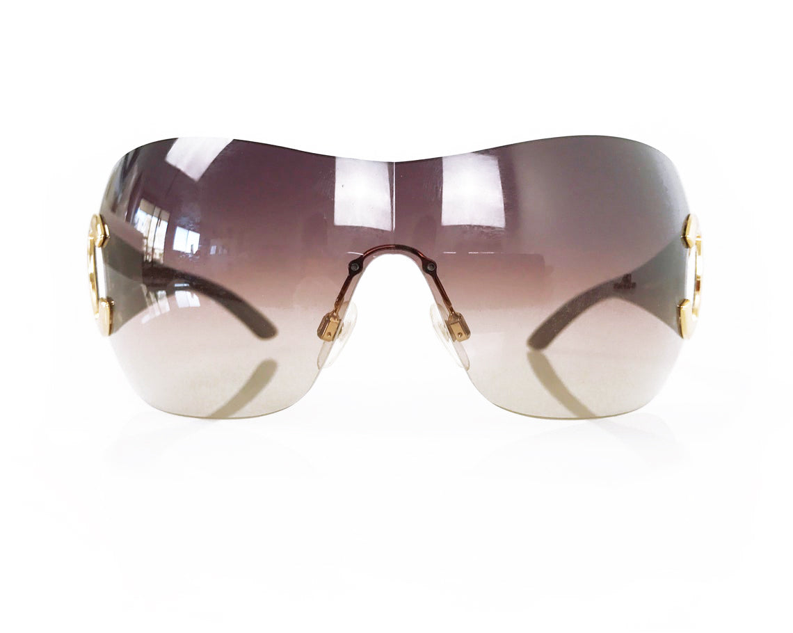 Fruit Vintage Chanel large Y2K logo sunglasses. They feature big Chanel CC logo monograms to each side and a classic early 2000s shield shape.