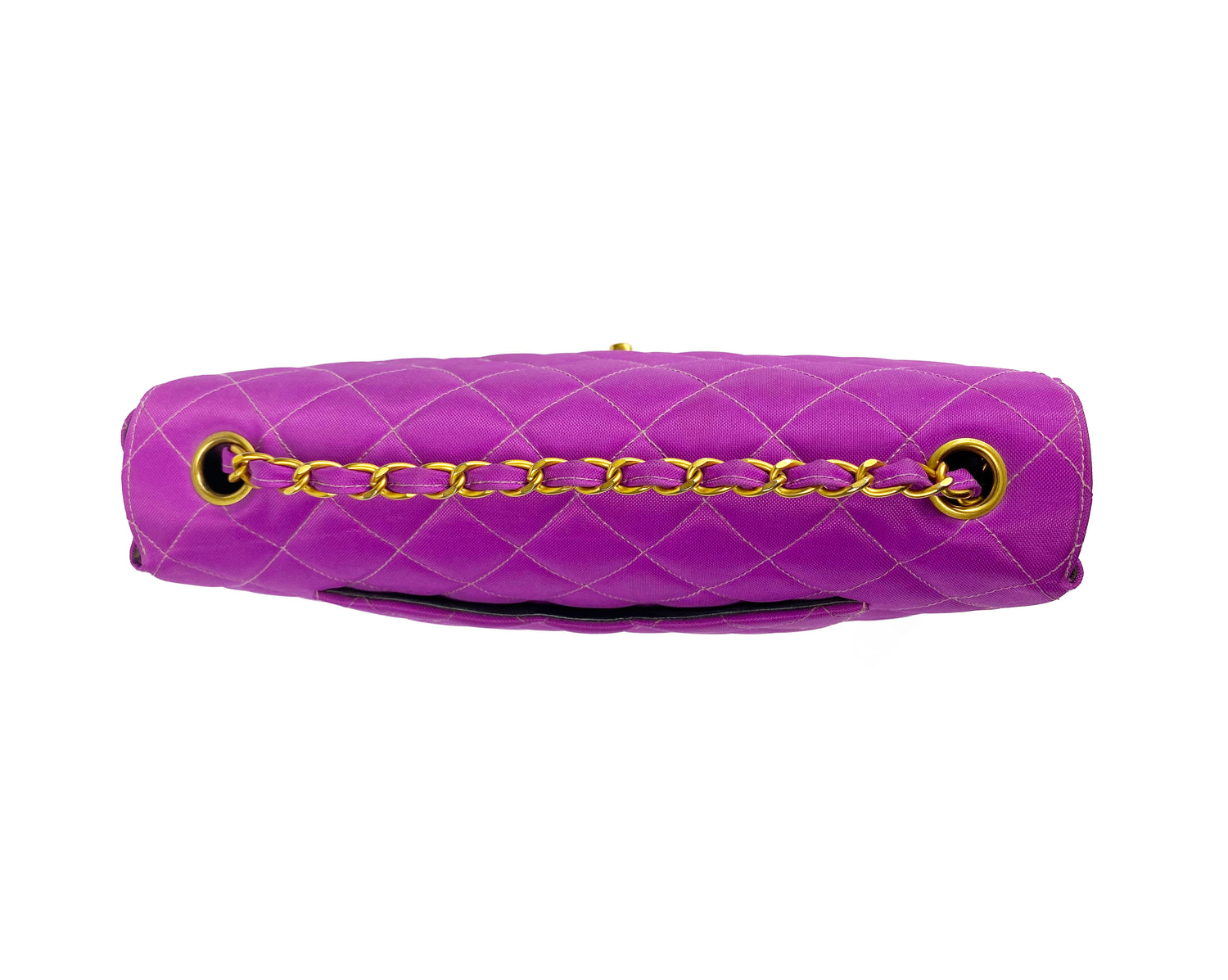 Fruit Vintage classic Chanel quilted nylon flap bag in extremely rare purple nylon, dating to 1995. Features the classic Chanel flap structure with contrast pale purple stitching and matte gold hardware.
