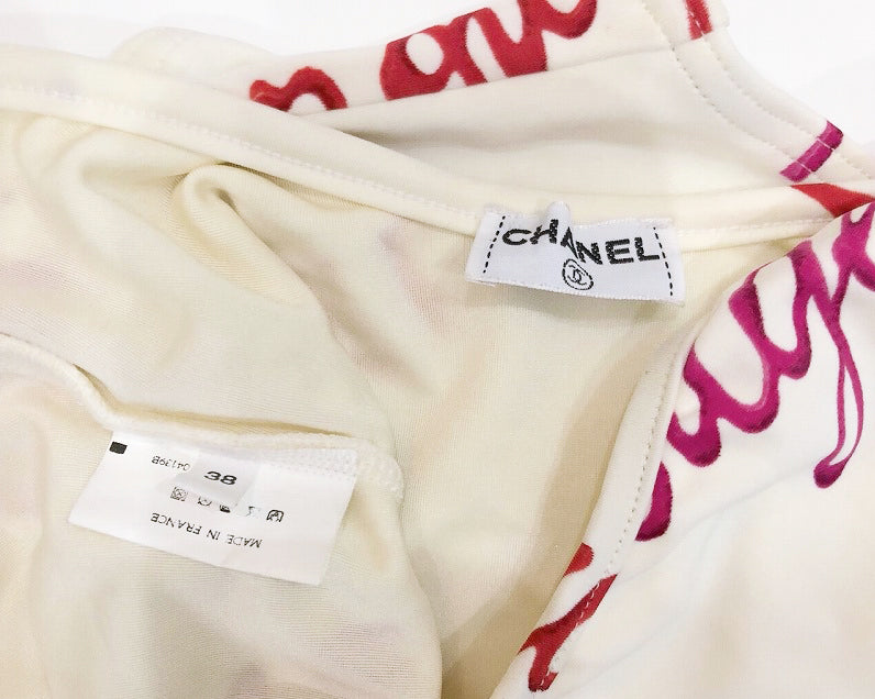 FRUIT Vintage rare Chanel Rouge 1996 Logo text off white one piece swimsuit bodysuit by Karl Lagerfeld. Features a large pink text print and a classic flattering cut with low back.