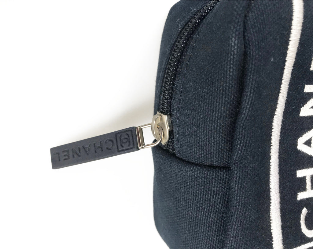 Fruit Vintage Chanel tennis ball set - a rare and important Chanel collectors accessory. It features a 4 Chanel tennis balls (2 pink and 2 blue) in a navy zipper accessory pouch with logo embroidery.