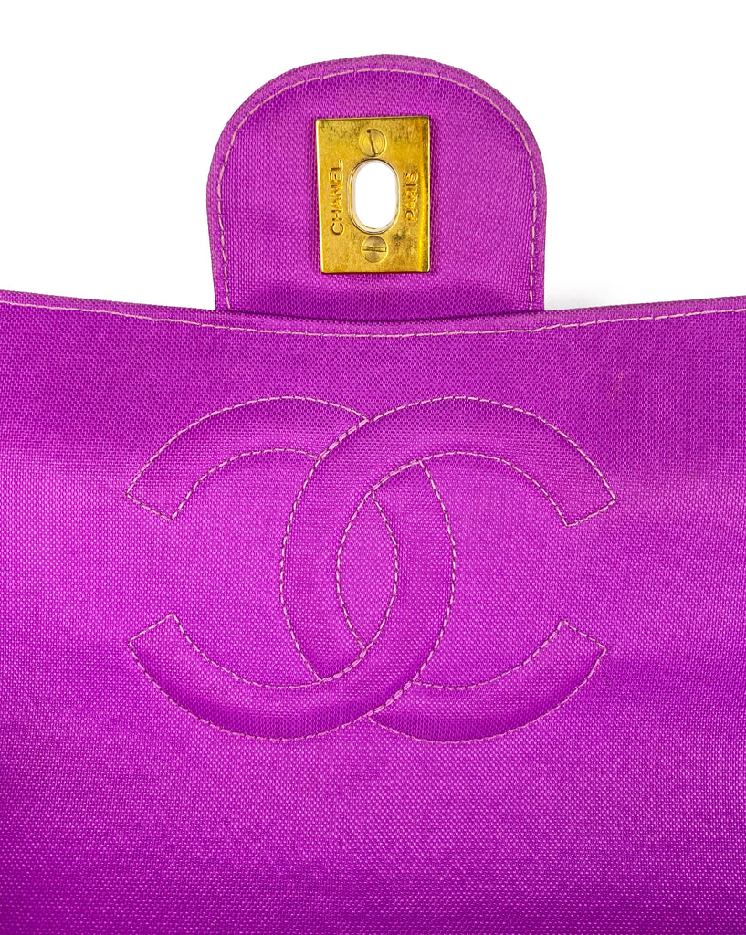 Fruit Vintage classic Chanel quilted nylon flap bag in extremely rare purple nylon, dating to 1995. Features the classic Chanel flap structure with contrast pale purple stitching and matte gold hardware.