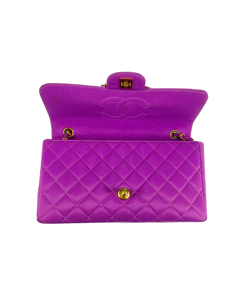 Fruit Vintage classic Chanel quilted nylon flap bag in extremely rare purple nylon, dating to 1995. Features the classic Chanel flap structure with contrast pale purple stitching and matte gold hardware.