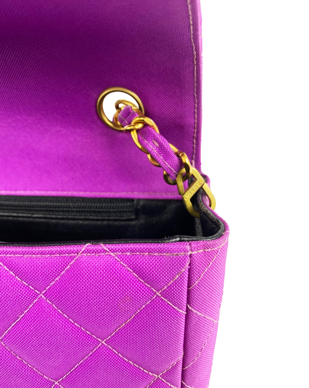 Fruit Vintage classic Chanel quilted nylon flap bag in extremely rare purple nylon, dating to 1995. Features the classic Chanel flap structure with contrast pale purple stitching and matte gold hardware.