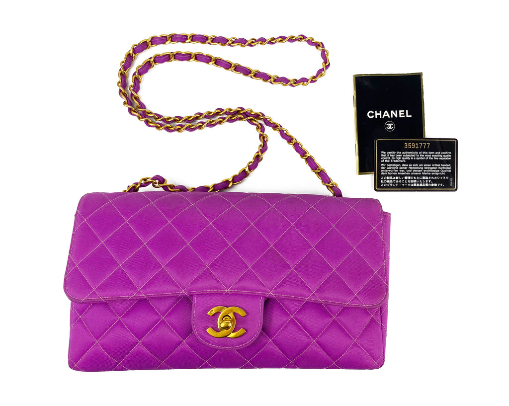 Fruit Vintage classic Chanel quilted nylon flap bag in extremely rare purple nylon, dating to 1995. Features the classic Chanel flap structure with contrast pale purple stitching and matte gold hardware.