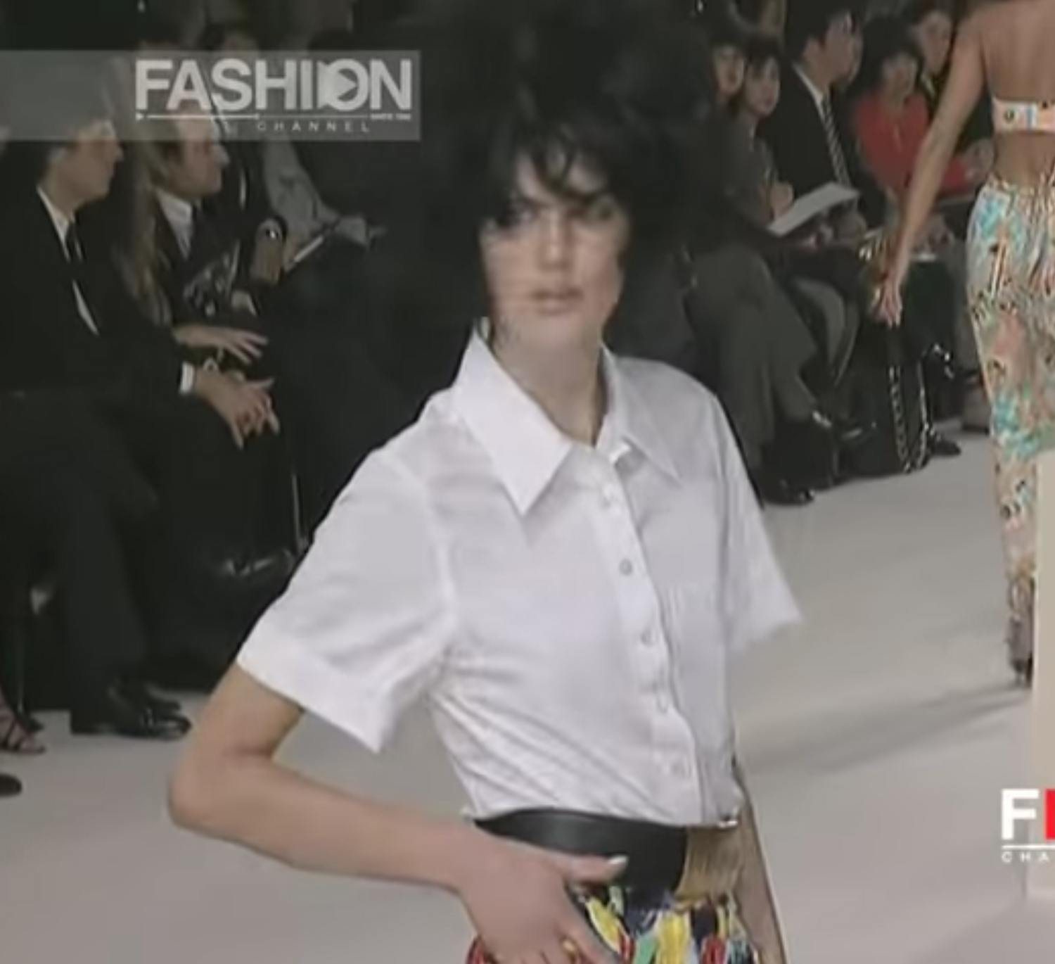 A rare, large Chanel Logo Waist Belt from 1997 -as worn on the runway by Naomi Campbell and Stella Tenant. It features a very large gold bar with CHANEL logo at the front, internal logo foil stamp and date, and gold buckle at rear.