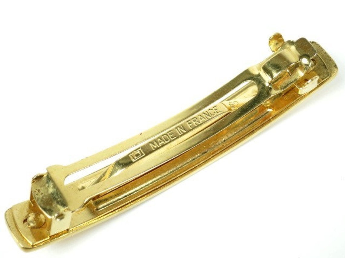 Fruit Vintage Chanel gold text logo barrette hair clip.