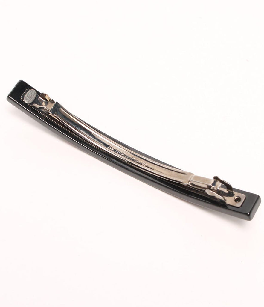 Fruit Vintage Chanel 2003 text logo barrette in black with cross bones. Features large Chanel text logos and two CC monograms either side.