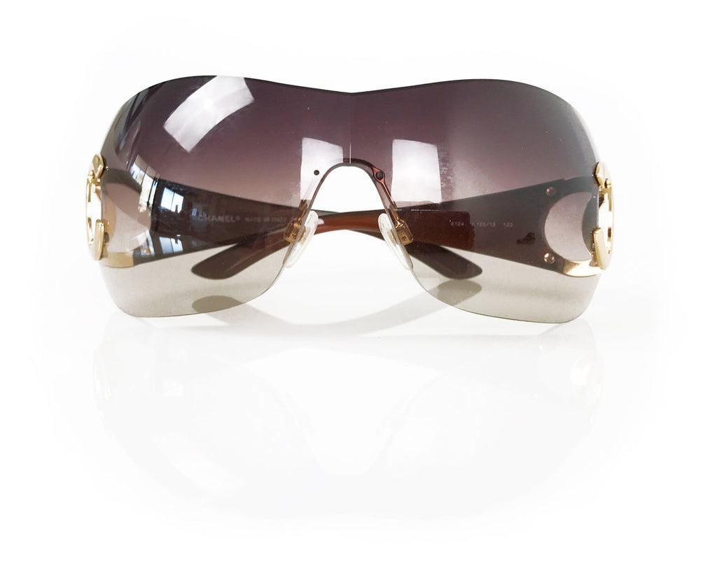 Fruit Vintage Chanel large Y2K logo sunglasses. They feature big Chanel CC logo monograms to each side and a classic early 2000s shield shape.