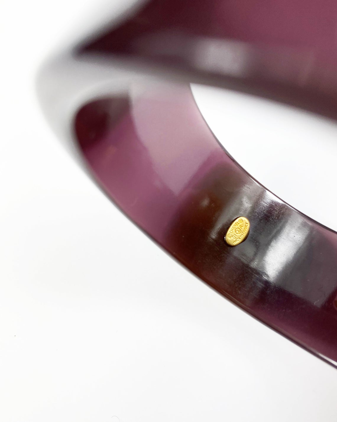 Fruit Vintage Chanel Purple and beige resin bangle. Features a classic interlocking CC logo to either side (this is a metal charm set into the resin).