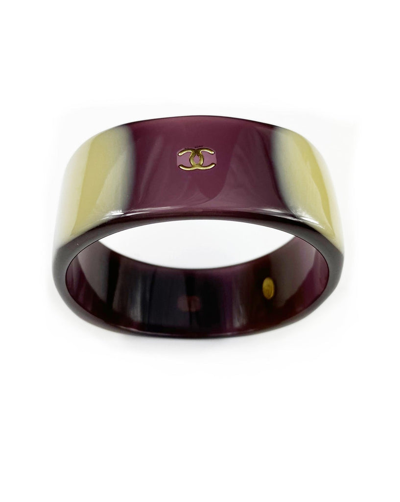 Fruit Vintage Chanel Purple and beige resin bangle. Features a classic interlocking CC logo to either side (this is a metal charm set into the resin).