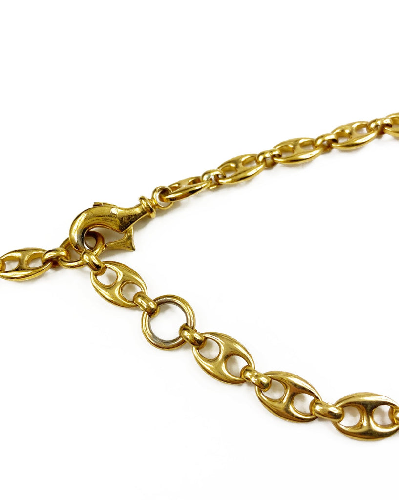 Fruit Vintage Gucci 1980s logo chain belt in classic gold. Features a lobster clip closure and significant logo drop Gucci GG charm. Looks incredible when worn as a necklace.