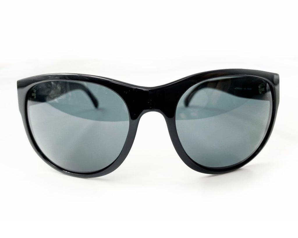 Fruit Vintage classic Chanel black logo sunglasses. They feature Chanel CC logo monograms to each side made from silver mirror.