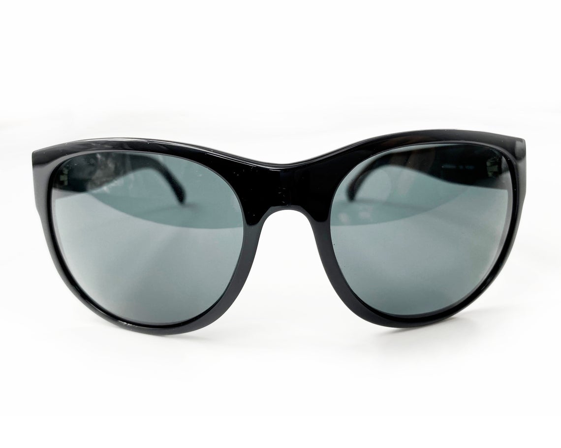 Fruit Vintage classic Chanel black logo sunglasses. They feature Chanel CC logo monograms to each side made from silver mirror.