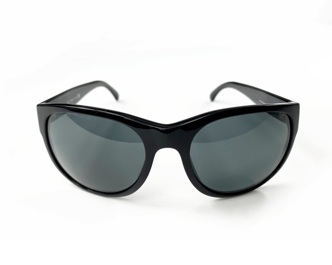 Fruit Vintage classic Chanel black logo sunglasses. They feature Chanel CC logo monograms to each side made from silver mirror.