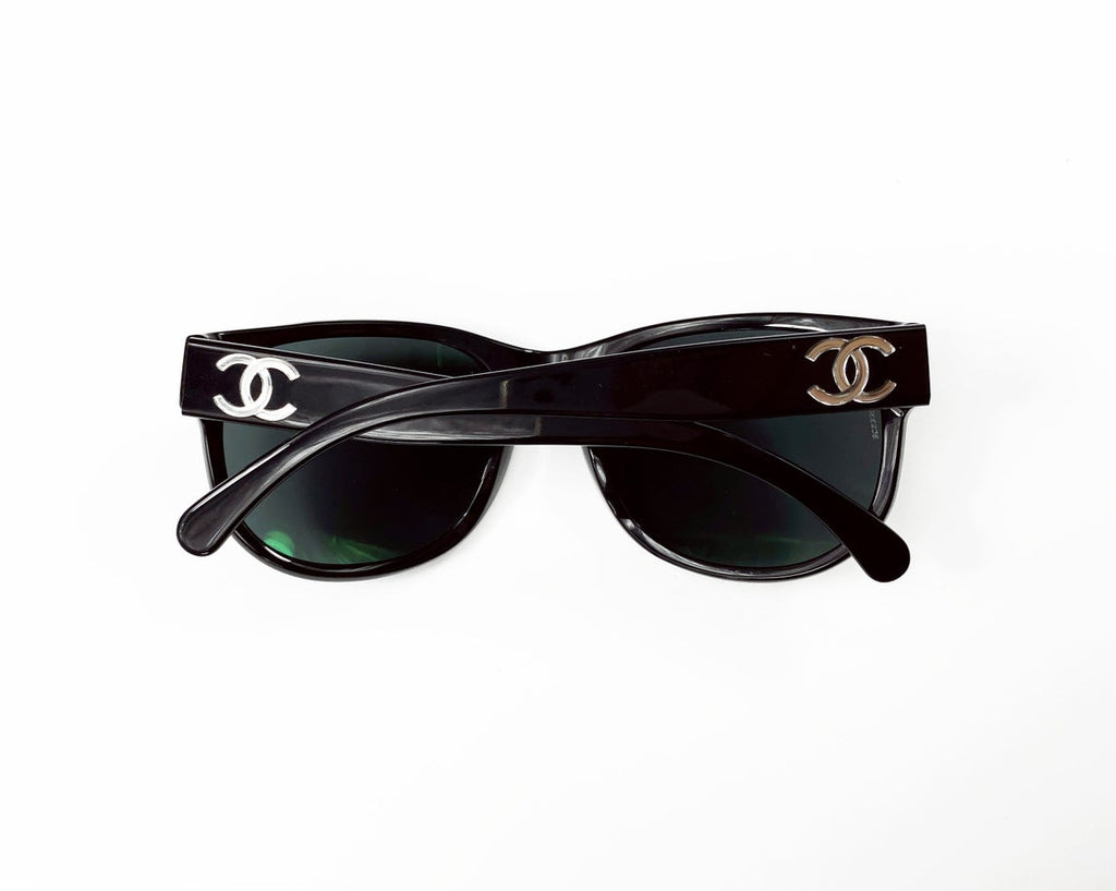 Fruit Vintage classic Chanel black logo sunglasses. They feature Chanel CC logo monograms to each side made from silver mirror.