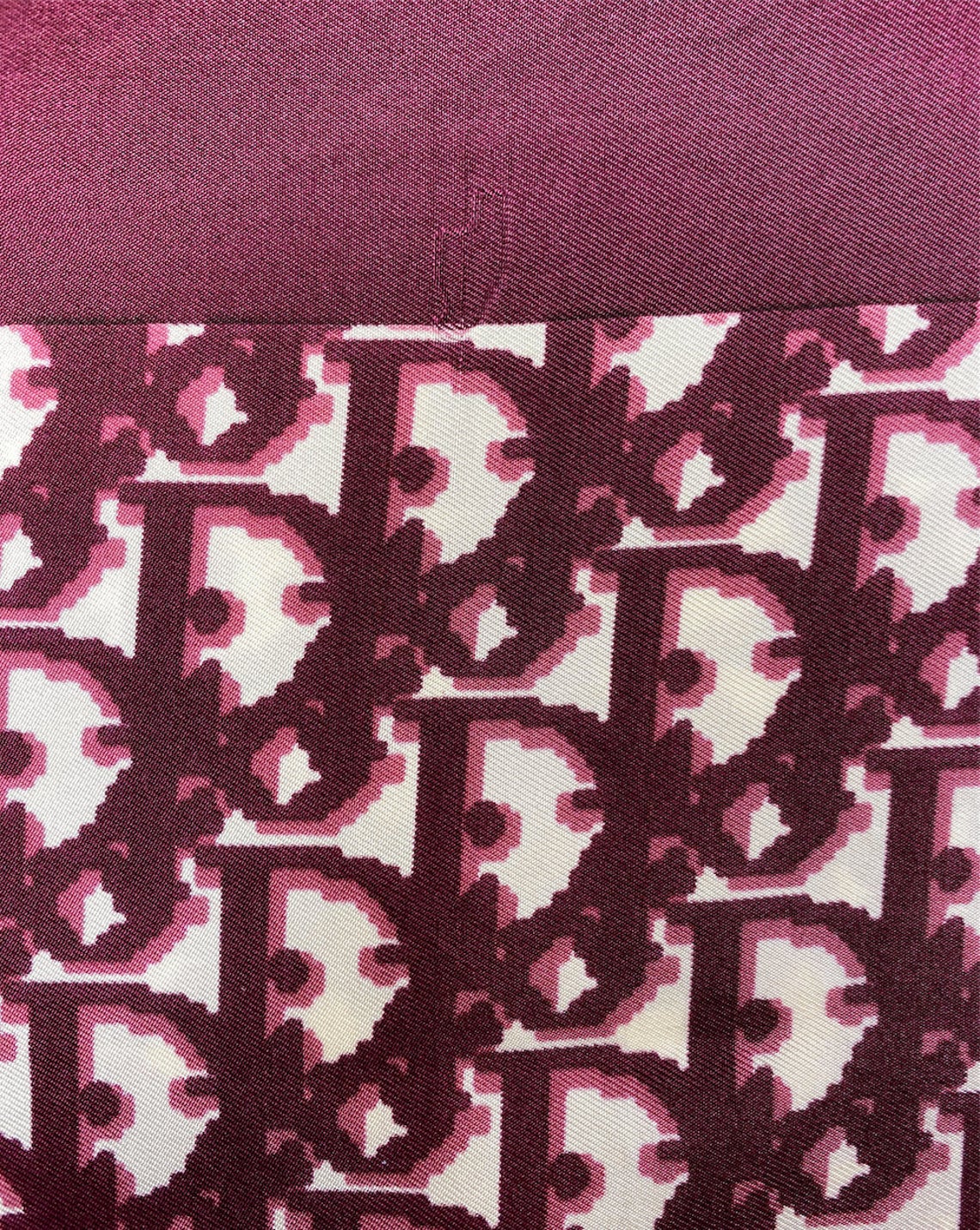 Fruit Vintage Christian Dior oblique print silk scarf in deep red/maroon. Features a bold graphic Dior logo print and hand finished rolled hem edging.
