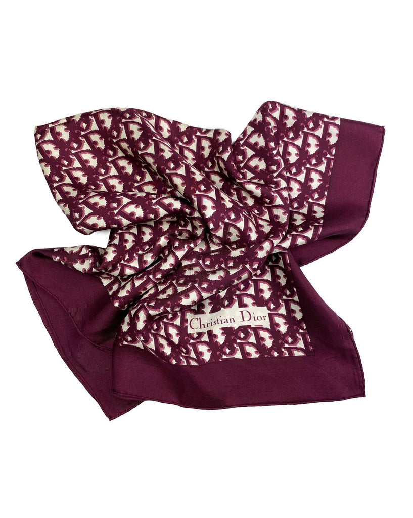 Fruit Vintage Christian Dior oblique print silk scarf in deep red/maroon. Features a bold graphic Dior logo print and hand finished rolled hem edging.