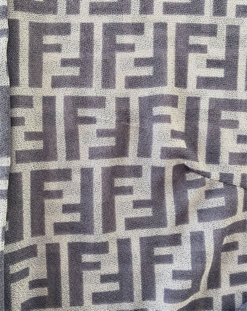 FRUIT Vintage Fendi Zucca print button up shirt dating to the early 90s. This amazing piece is made from a sheer mesh and features a bold Fendi Zucca print in two tone grey.