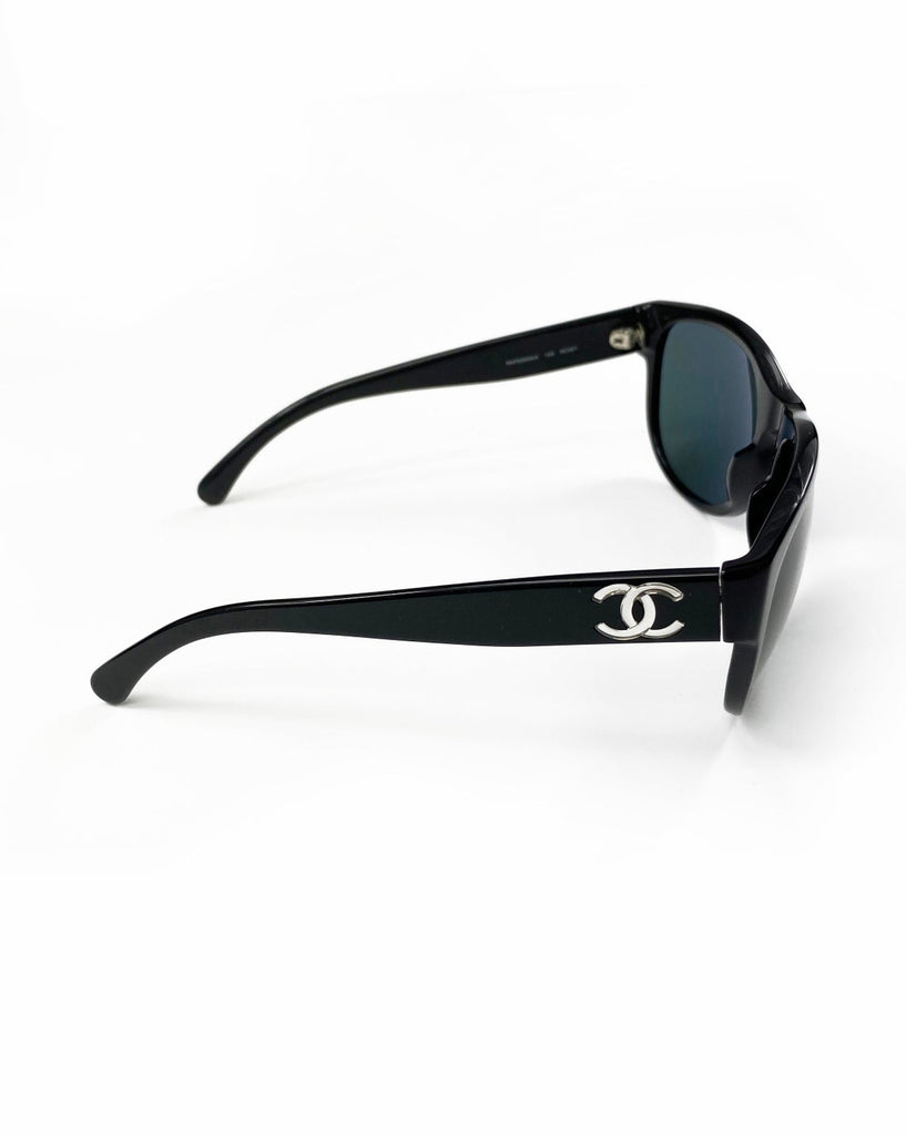Fruit Vintage classic Chanel black logo sunglasses. They feature Chanel CC logo monograms to each side made from silver mirror.