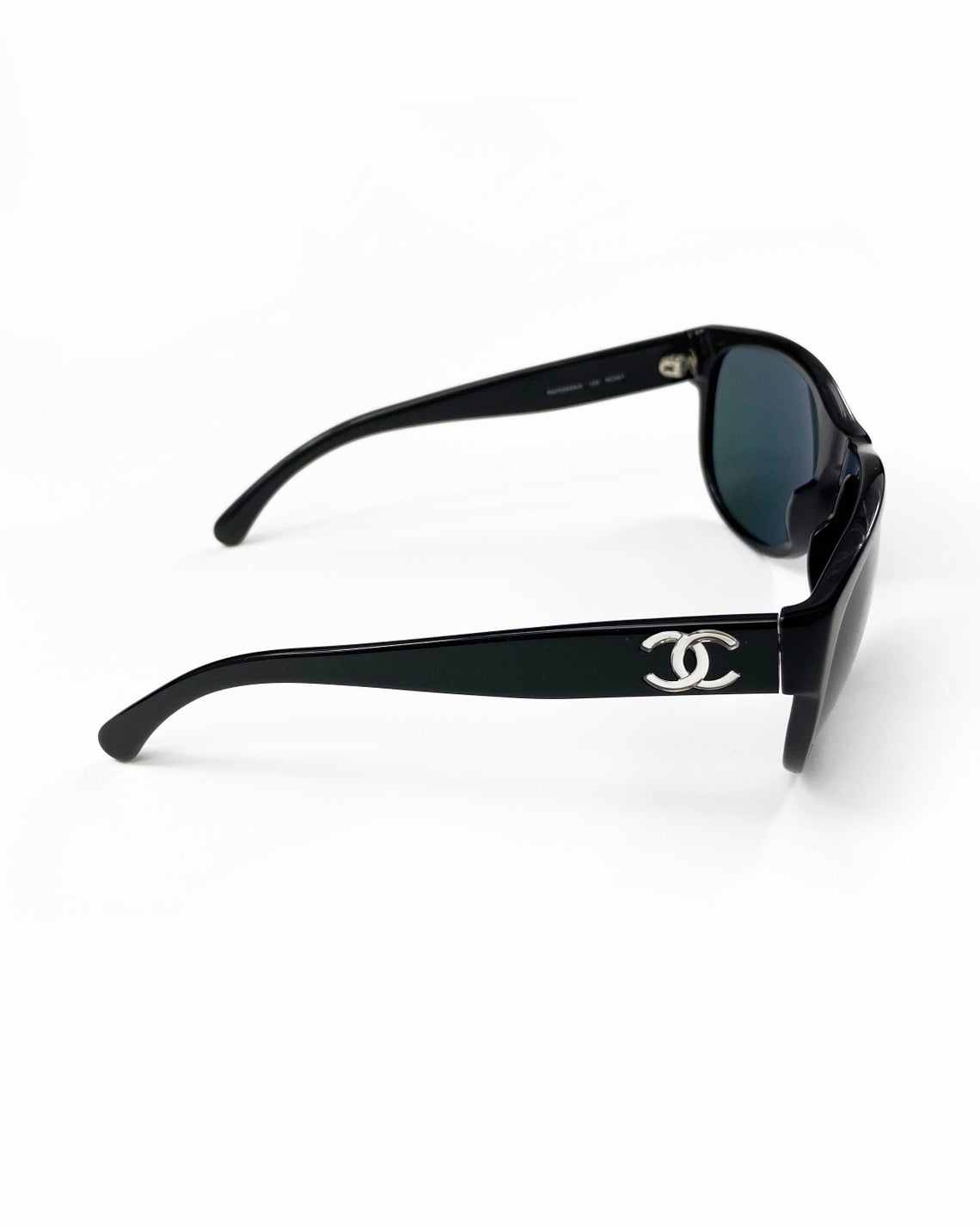 Fruit Vintage classic Chanel black logo sunglasses. They feature Chanel CC logo monograms to each side made from silver mirror.