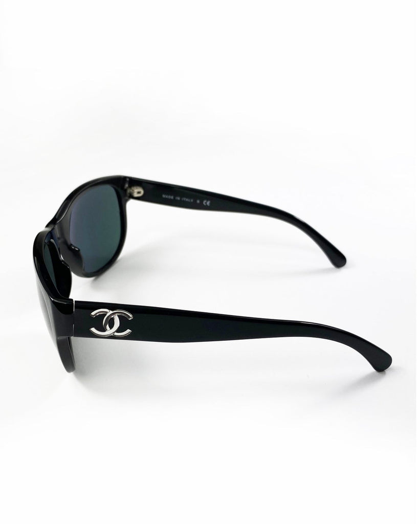 Fruit Vintage classic Chanel black logo sunglasses. They feature Chanel CC logo monograms to each side made from silver mirror.