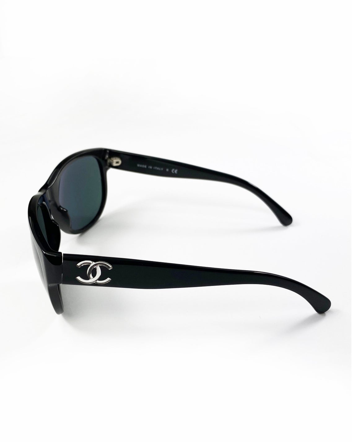 Fruit Vintage classic Chanel black logo sunglasses. They feature Chanel CC logo monograms to each side made from silver mirror.