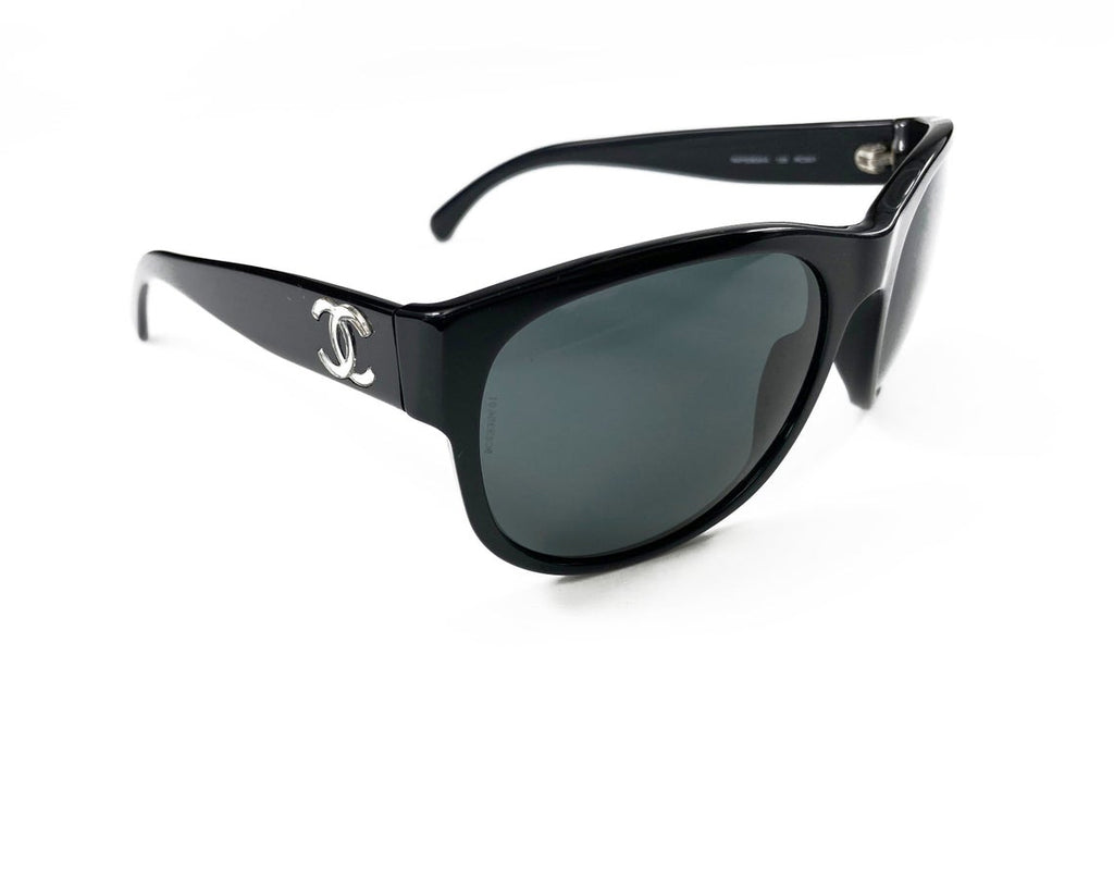 Fruit Vintage classic Chanel black logo sunglasses. They feature Chanel CC logo monograms to each side made from silver mirror.