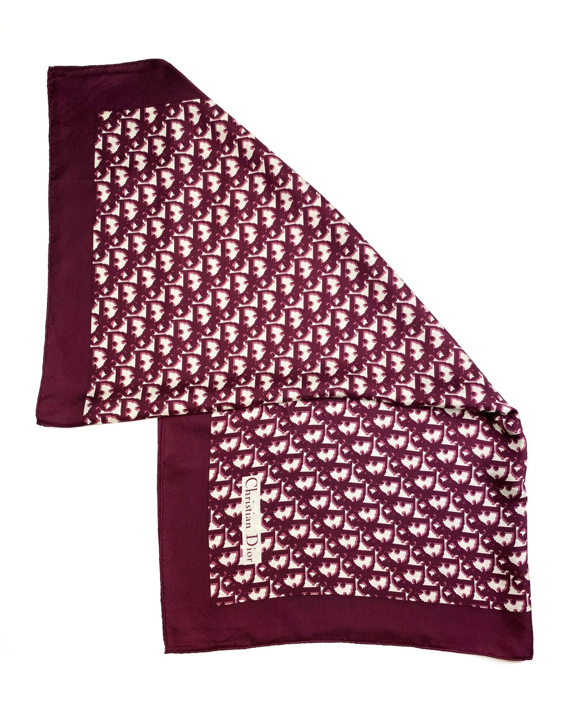 Fruit Vintage Christian Dior oblique print silk scarf in deep red/maroon. Features a bold graphic Dior logo print and hand finished rolled hem edging.
