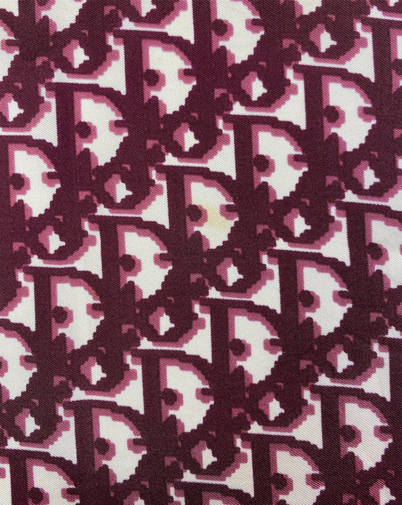 Fruit Vintage Christian Dior oblique print silk scarf in deep red/maroon. Features a bold graphic Dior logo print and hand finished rolled hem edging.