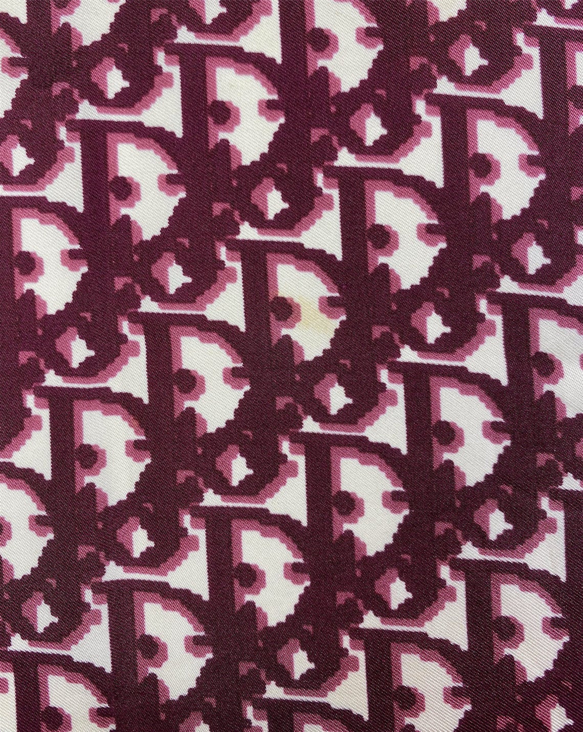 Fruit Vintage Christian Dior oblique print silk scarf in deep red/maroon. Features a bold graphic Dior logo print and hand finished rolled hem edging.