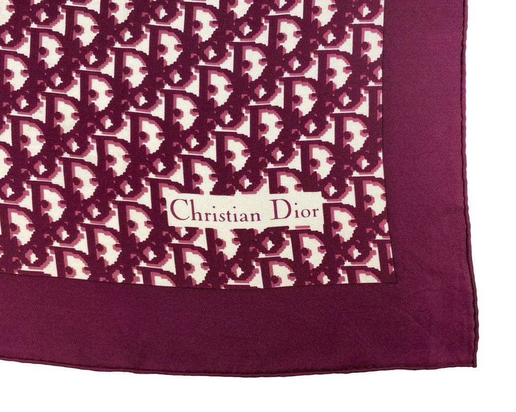 Fruit Vintage Christian Dior oblique print silk scarf in deep red/maroon. Features a bold graphic Dior logo print and hand finished rolled hem edging.