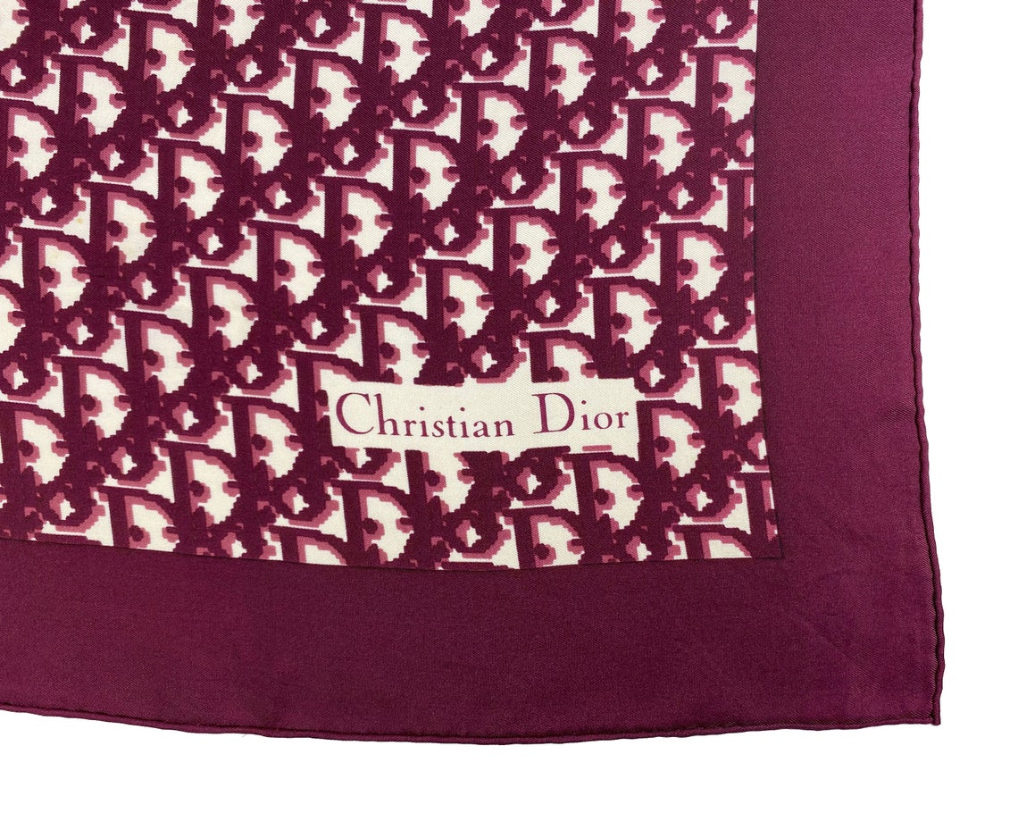 Fruit Vintage Christian Dior oblique print silk scarf in deep red/maroon. Features a bold graphic Dior logo print and hand finished rolled hem edging.