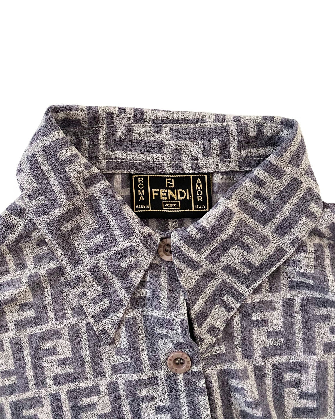 FRUIT Vintage Fendi Zucca print button up shirt dating to the early 90s. This amazing piece is made from a sheer mesh and features a bold Fendi Zucca print in two tone grey.