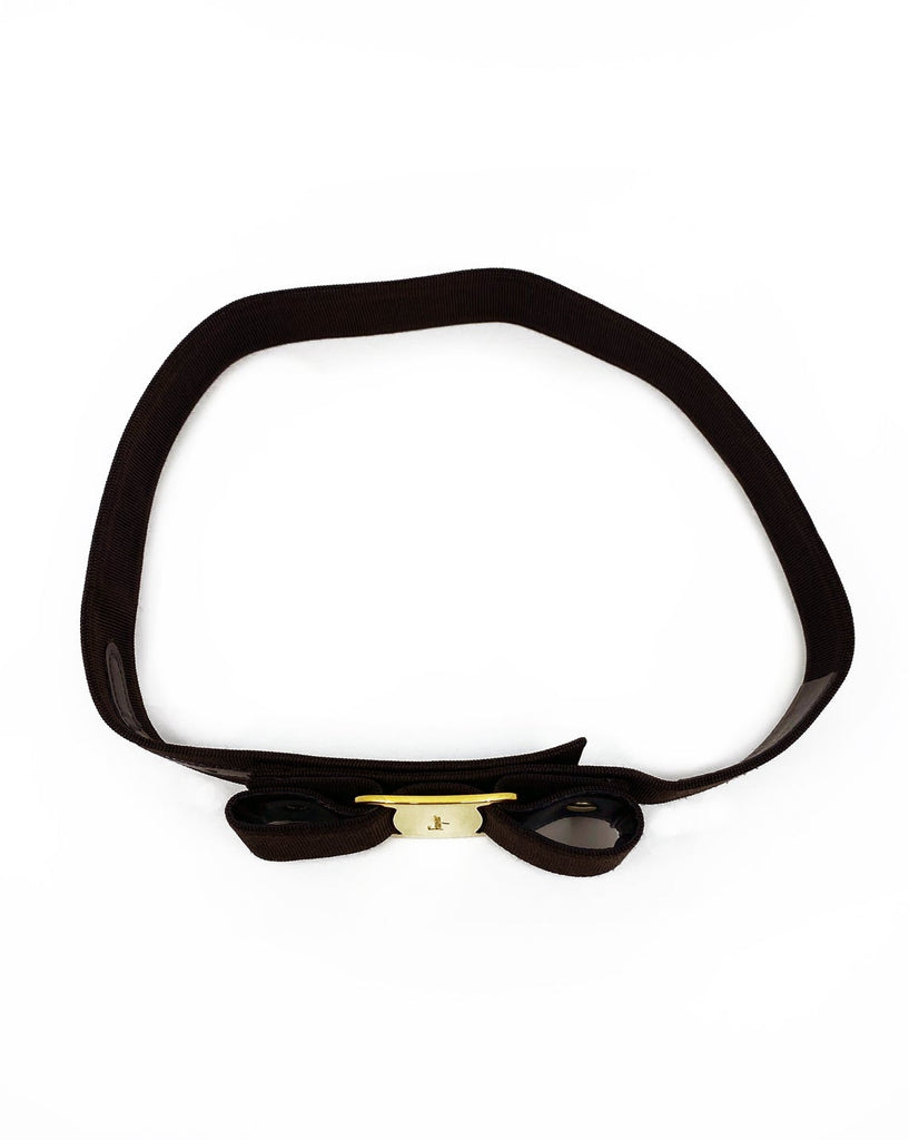 Fruit Vintage Salvatore Ferragamo 1980s bow belt in dark brown gross grain fabric. It features the iconic Ferragamo bow design with a large logo plate at front.