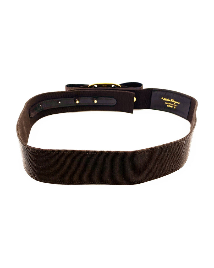 Fruit Vintage Salvatore Ferragamo 1980s bow belt in dark brown gross grain fabric. It features the iconic Ferragamo bow design with a large logo plate at front.