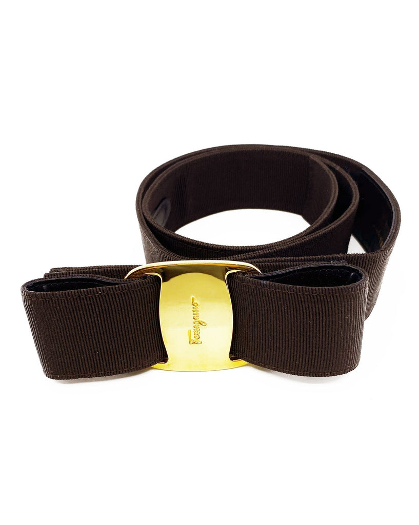 Fruit Vintage Salvatore Ferragamo 1980s bow belt in dark brown gross grain fabric. It features the iconic Ferragamo bow design with a large logo plate at front.