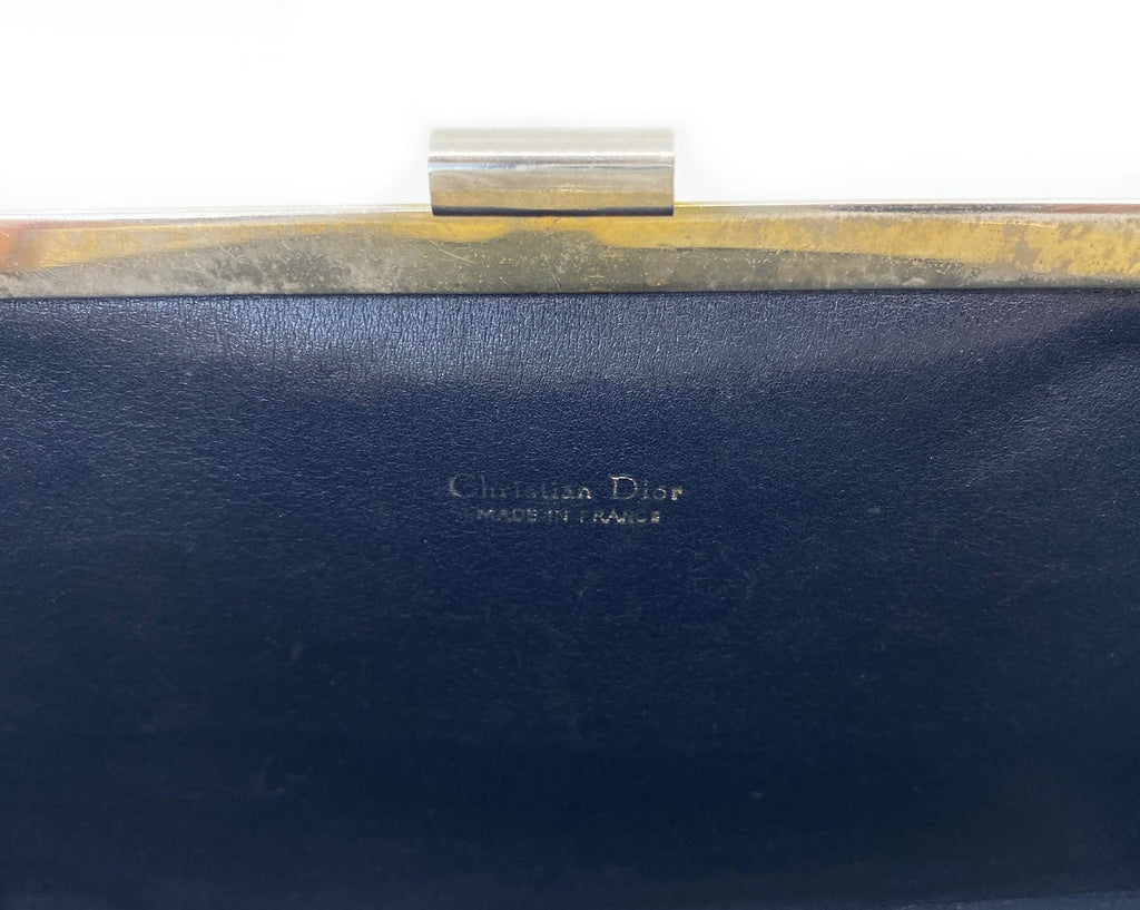 FRUIT vintage 1970s Christian Dior logo clutch bag is made of Navy Dior trotter print canvas and features a gold hardware clip top closure.