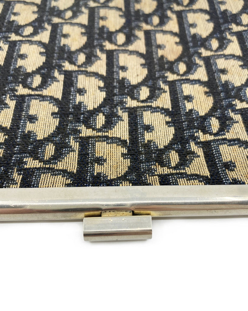 FRUIT vintage 1970s Christian Dior logo clutch bag is made of Navy Dior trotter print canvas and features a gold hardware clip top closure.