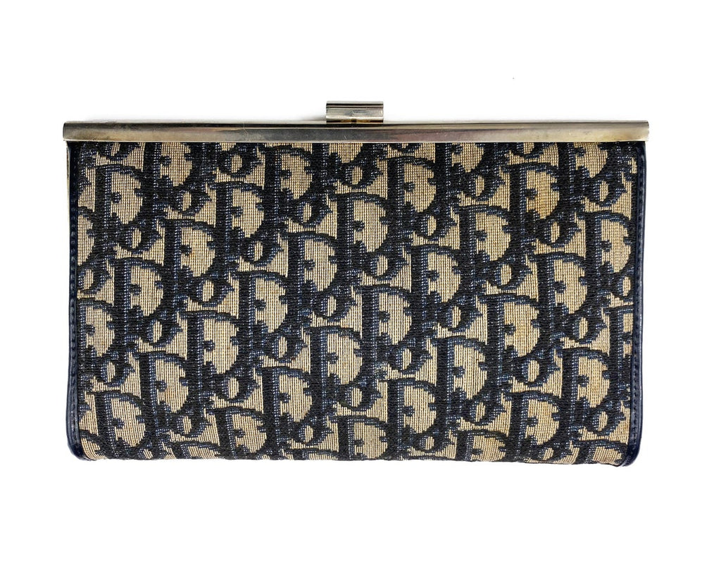 FRUIT vintage 1970s Christian Dior logo clutch bag is made of Navy Dior trotter print canvas and features a gold hardware clip top closure.