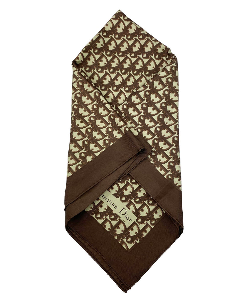 Fruit Vintage Christian Dior oblique print silk scarf in brown. Features a bold graphic Dior logo print and hand finished rolled hem edging.