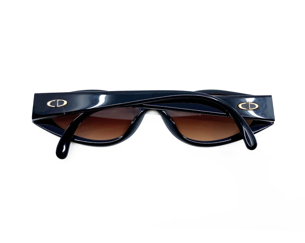 Fruit Vintage Christian Dior sunglasses dating to 1990. These small oval frames feature a gold trim over the nose and CD logo to each arm.