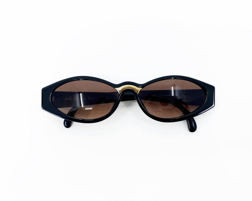 Fruit Vintage Christian Dior sunglasses dating to 1990. These small oval frames feature a gold trim over the nose and CD logo to each arm.