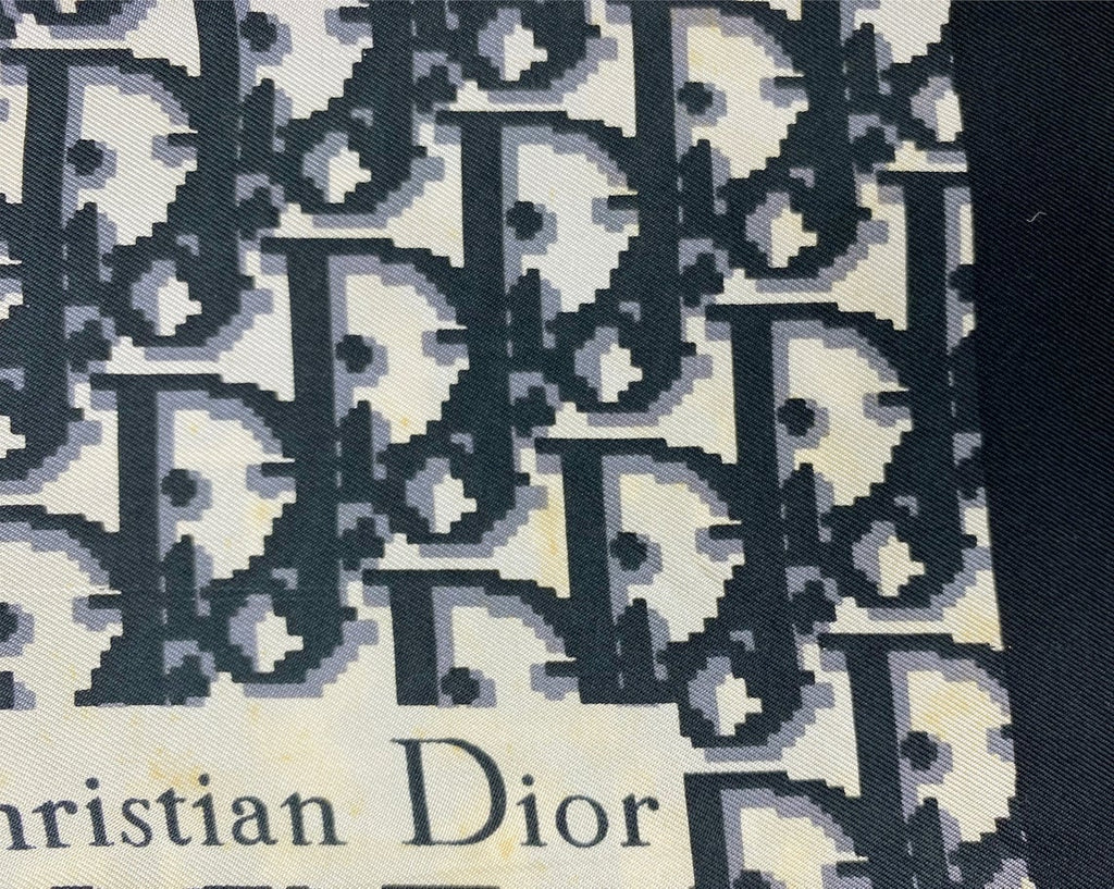 Fruit Vintage Christian Dior oblique print silk scarf in black and grey. Features a bold graphic Dior logo print and hand finished rolled hem edging.