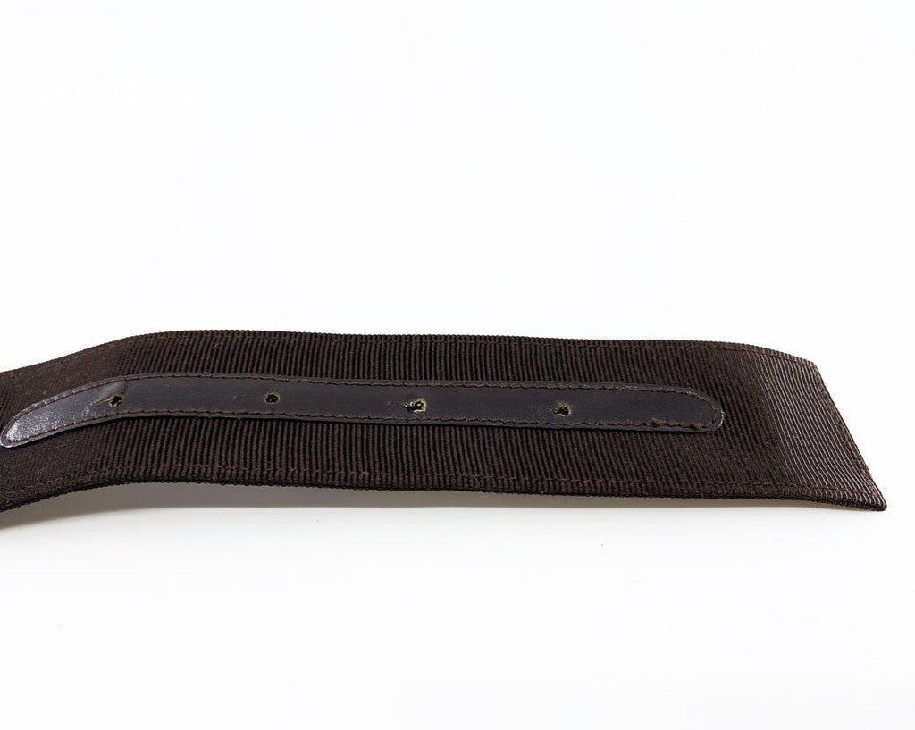 Fruit Vintage Salvatore Ferragamo 1980s bow belt in dark brown gross grain fabric. It features the iconic Ferragamo bow design with a large logo plate at front.