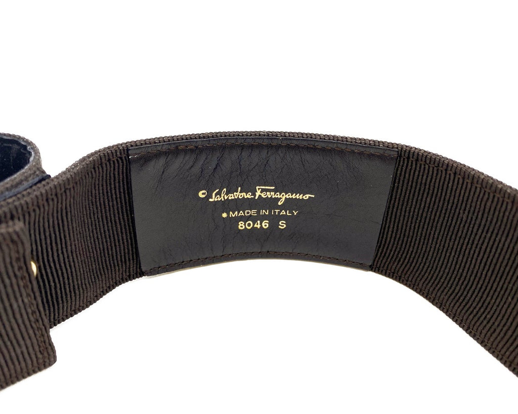 Fruit Vintage Salvatore Ferragamo 1980s bow belt in dark brown gross grain fabric. It features the iconic Ferragamo bow design with a large logo plate at front.