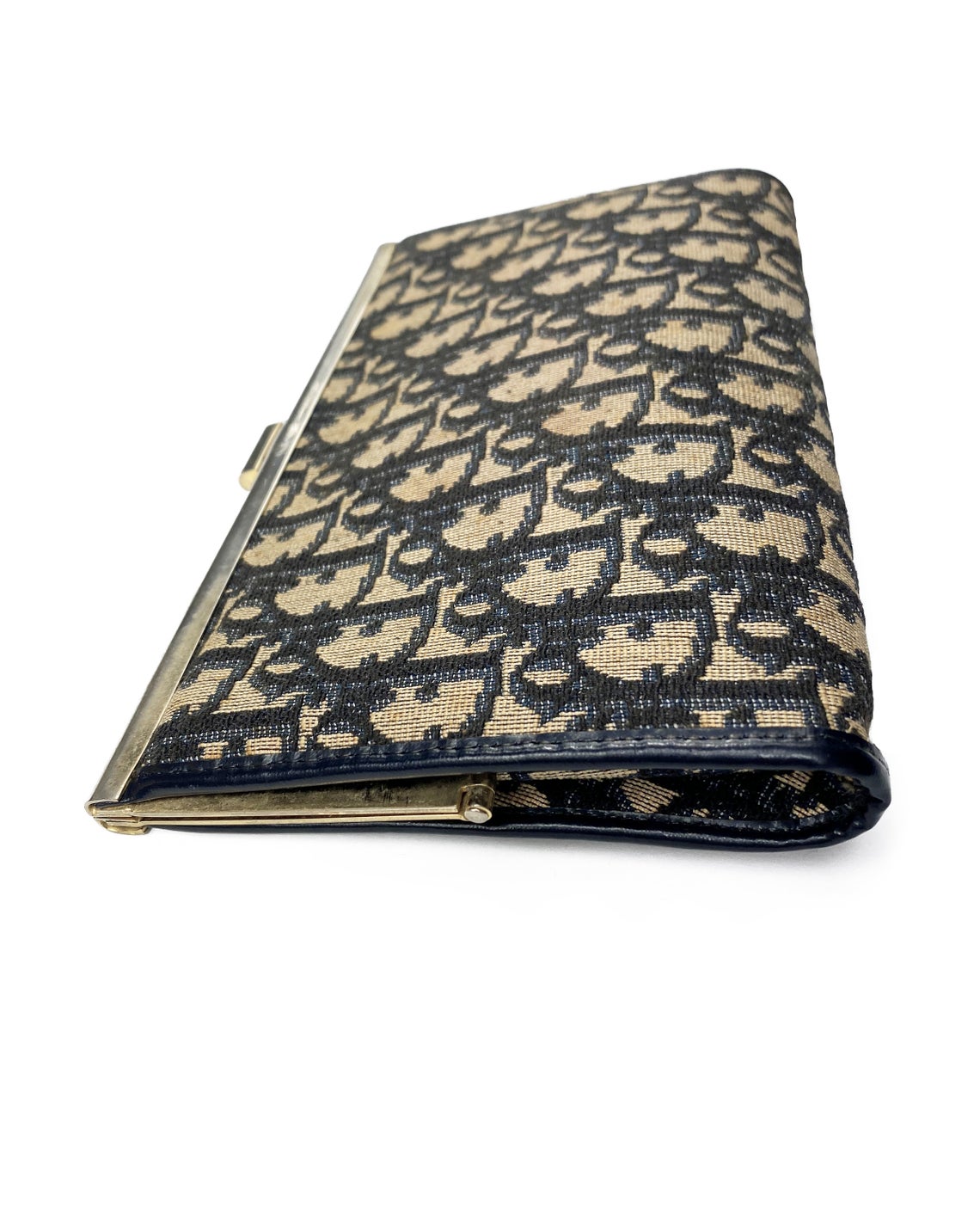 FRUIT vintage 1970s Christian Dior logo clutch bag is made of Navy Dior trotter print canvas and features a gold hardware clip top closure.