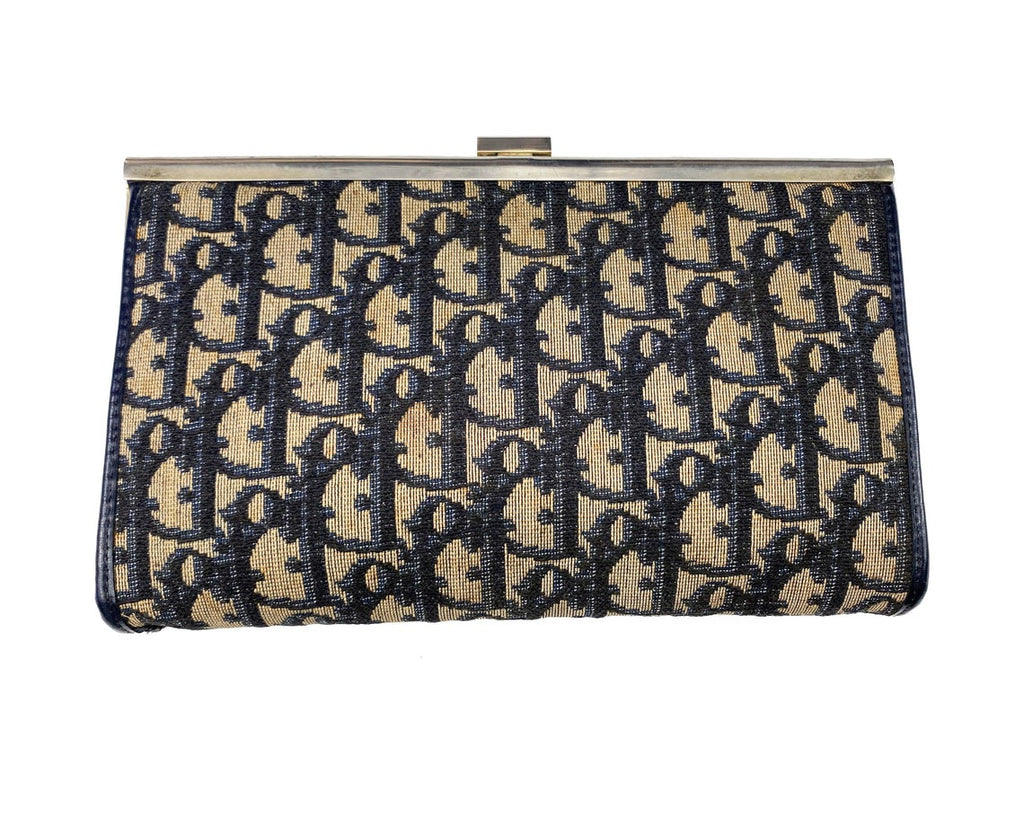 FRUIT vintage 1970s Christian Dior logo clutch bag is made of Navy Dior trotter print canvas and features a gold hardware clip top closure.
